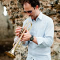 Sam won a trumpet scholarship to the Royal Academy in London & can play trumpet at Weddings
